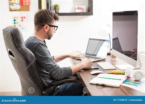 Young Man Working With Two Computers Stock Image Image Of Attractive