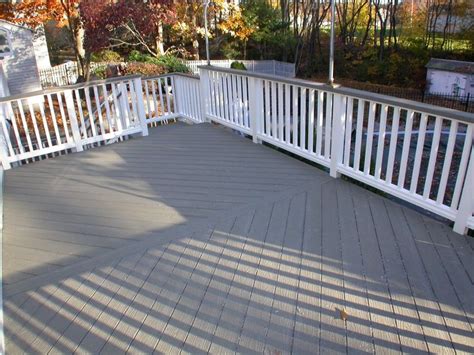 A dark grey would make the i like the colour. brown deck stain with grey house | Grey deck, Deck paint ...