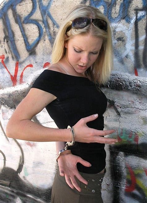Blonde Woman Thoroughly Checks The Handcuffs Shes Tied