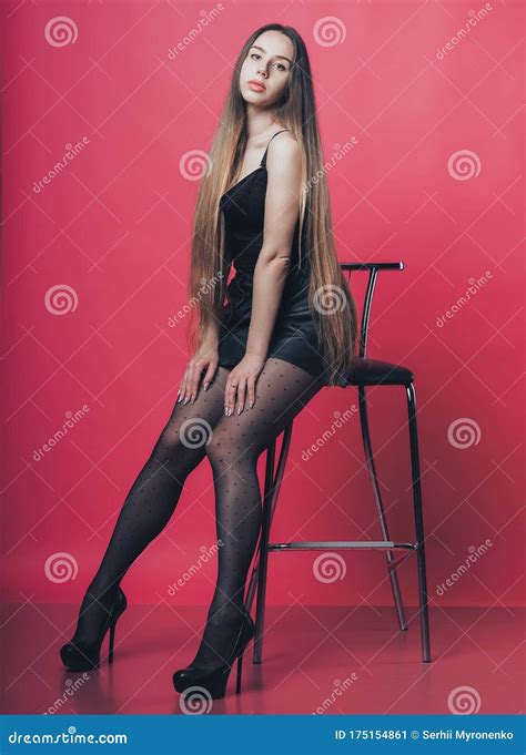 Brunette Girl Posing At The Pink Background Stock Image Image Of