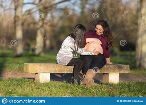 Young Pregnant Woman Showing Off Her Baby Bump Stock Image Image Of
