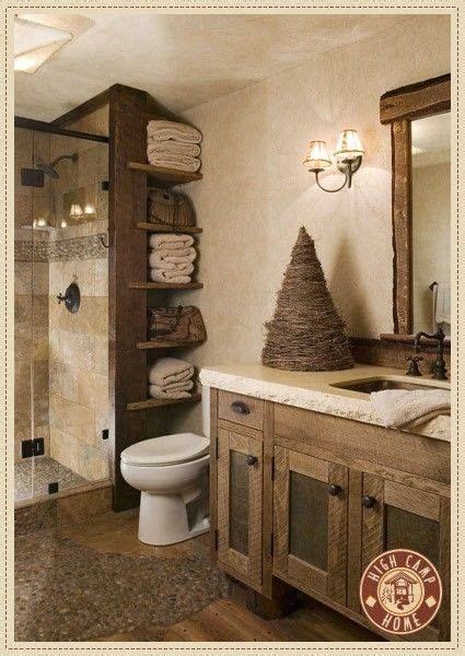 A Bathroom With A Toilet Shower And Shelves Filled With Folded Towels