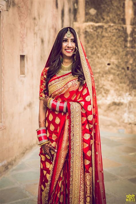 A Bride In A Red And Gold Benarasi Saree On Her Wedding Day Indian