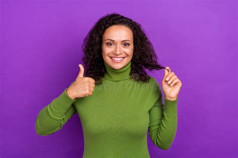 Photo Of Pretty Shiny Afro Woman Wear Green Turtleneck Showing Thumb Up