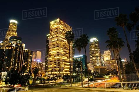 View Of Highway And City Skyline At Night Los Angeles