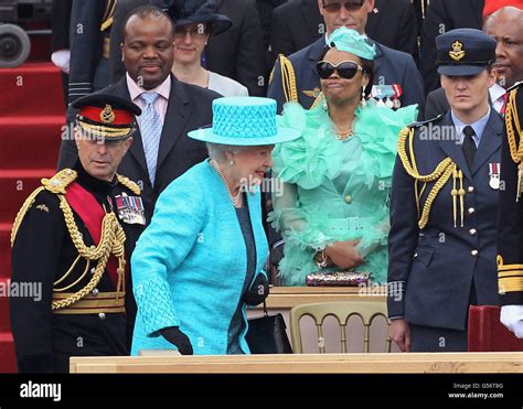 Queen Elizabeth Ii Walks Past King Mswati Iii Of Swaziland And