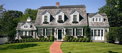 Dutch Colonial With Boxwoods And Window Boxes For The Home Facade