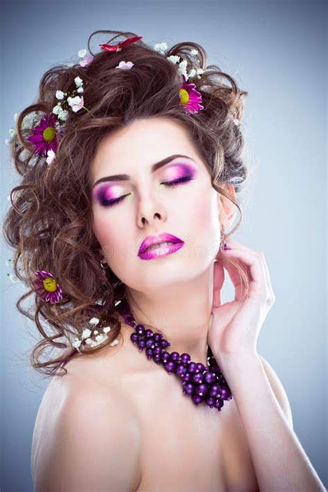 Young Beautiful Woman With Flowers In Her Hair And Bright Makeup Stock