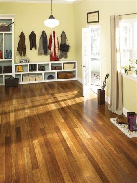 Light flooring against a white kitchen. 35 Bamboo Flooring Ideas With Pros And Cons - DigsDigs