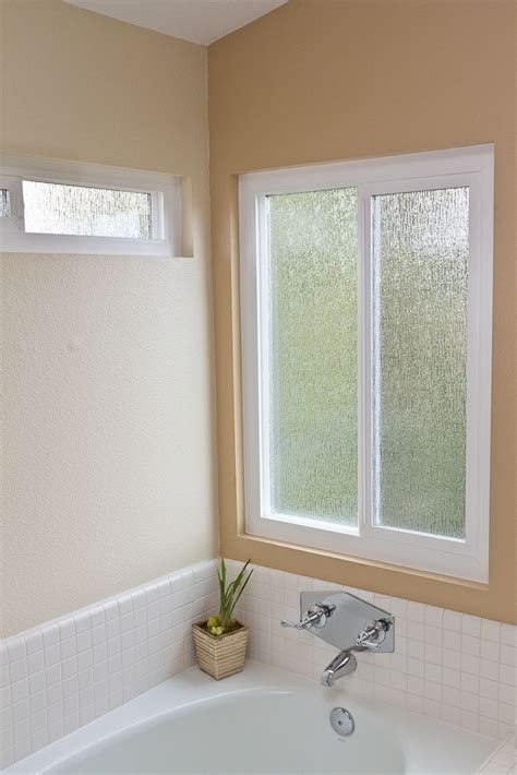rain patterned obscure privacy glass compliments and enhances this bathrooms modern decor