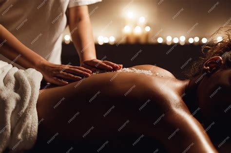 Premium Photo African American Woman Enjoying Salt Scrub Massage At