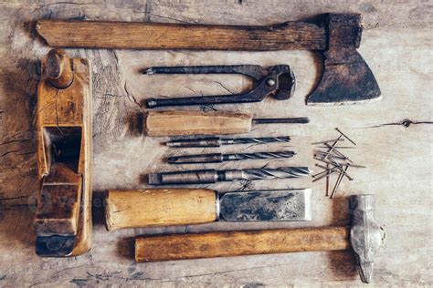 Old Construction Tools On A Wooden Workbench Flat Lay Background
