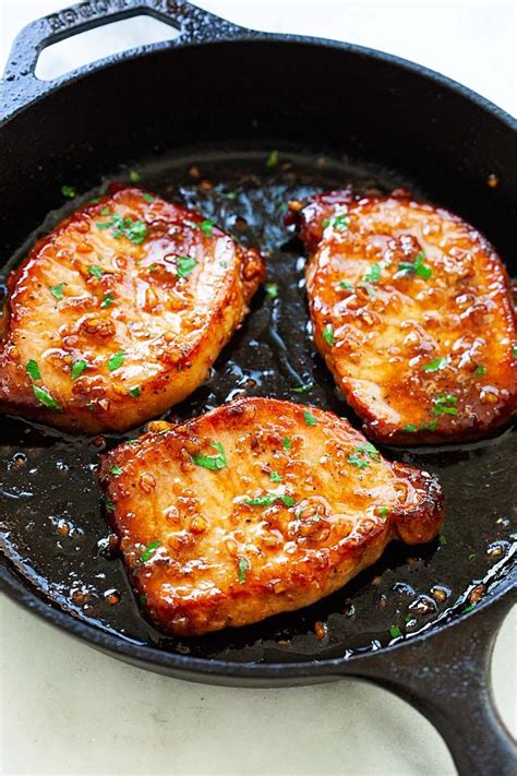 Place your chops into the center of the pan, neither touching the sides, nor one another. Honey garlic boneless pork chops in a skillet, ready to be ...
