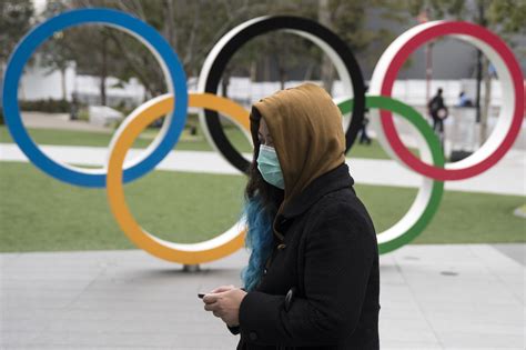 Tokyo Japan February 26 A Woman Wearing A Face Mask Walks Past The