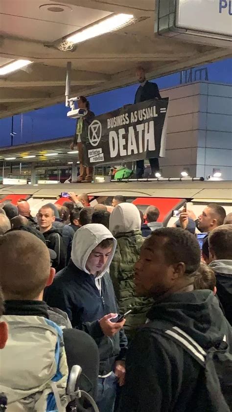 Angry Commuters Drag Extinction Rebellion Protester Off Train Roof After Rush Hour Protest On
