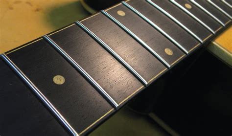 In this guitar maintenance lesson, learn how to clean and polish a rosewood fretboard using two different methods. How to Properly Clean a Rosewood Fingerboard - Guitar Space
