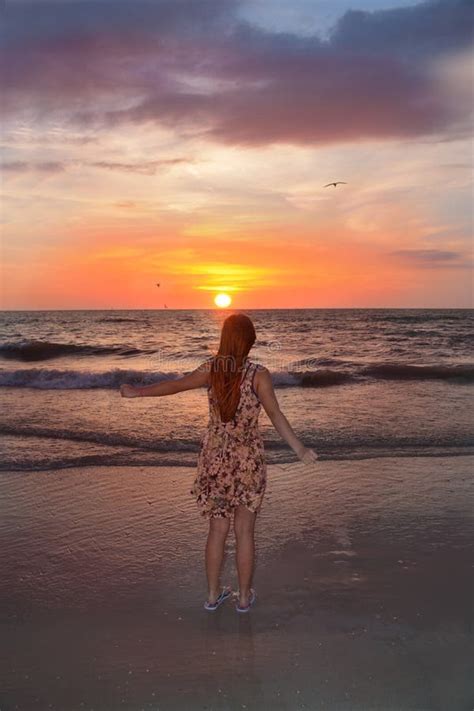 Happy Girl On The Beach At Sunset Stock Photo Image Of Comfortable