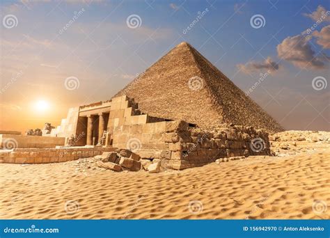 Mastaba Of Seshemnefer Iv And The Pyramid Of Cheops In Giza Stock Photo