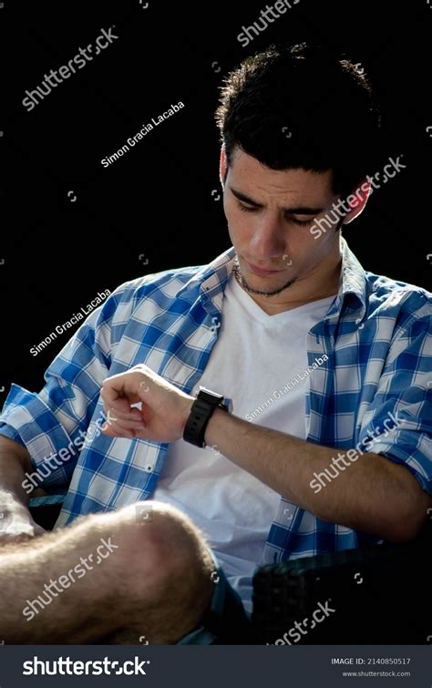 Elegant Young Man Looking His Wristwatch Stock Photo 2140850517