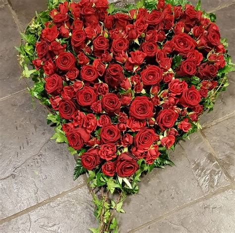 With Over 100 Luxury Red Rose Heads This Stunning Heart Shaped Tribute