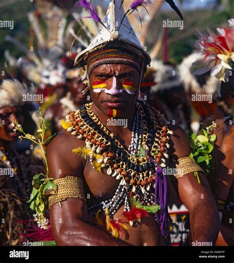 Male Tribesman From Papua New Guinea In Traditional Dress And Highly