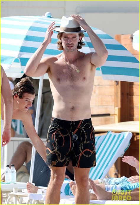 patrick schwarzenegger looks fit going shirtless at the beach photo 4488274 christopher