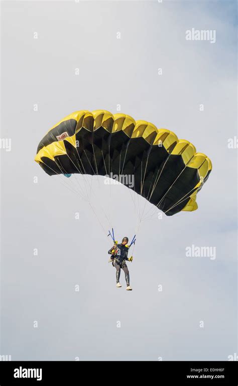 One Day With Parachutist In Airfield The Skydiver Landing Under Black