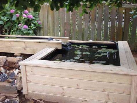 Side view of an modern, above ground koi pond with stacked rock & bog waterfall. Above ground koi pond off the deck, Aaron next project ...