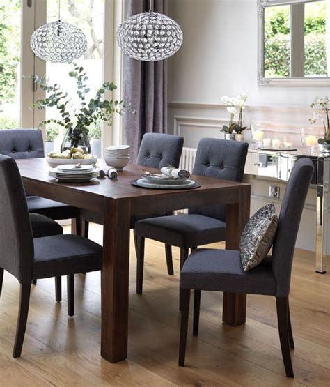 Cosmopolitan gray marble dining table. Home Dining Inspiration Ideas. Dining room with dark wood ...