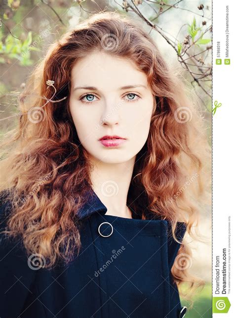 Young Woman Outdoors Girl With Red Curly Hair Stock Photo