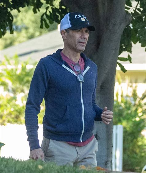 Eric McCormack out for a walk with his ring still on after wife filed