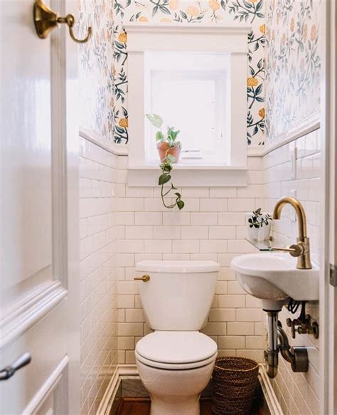 A light wallpaper like in this bathroom designed by studio db keeps things feeling sweet and airy. Wallpaper in bathroom | Bathroom design small, Small ...