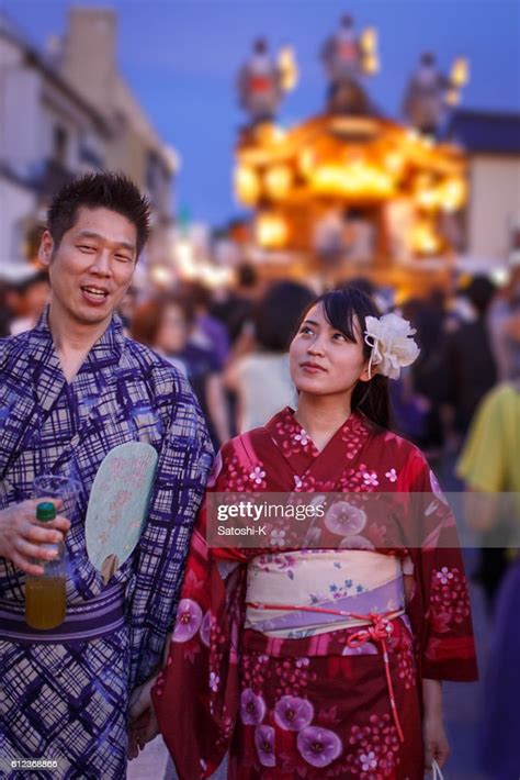 Japanese Yukata Couple Walking On Festive Street High Res Stock Photo