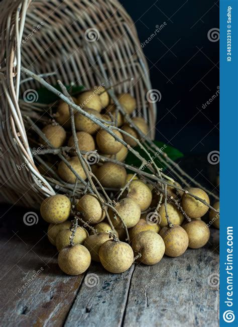 Longan Fruit From The Wicker Baskets On Wooden Floor Stock Image