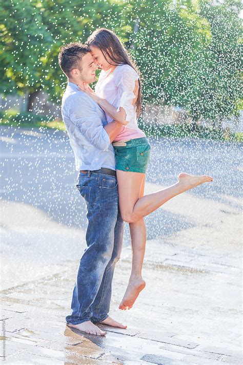 Couple Kissing In The Rain By Lumina