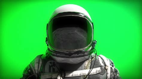 Spaceman Astronaut Standing Behind Green Screen Clipstock