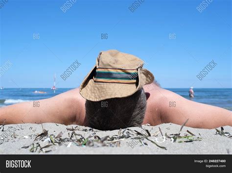 Man Sunbathes On Beach Image Photo Free Trial Bigstock
