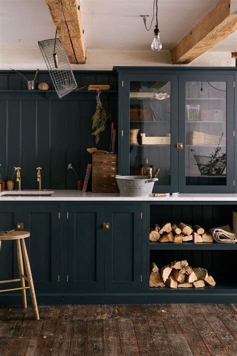 It ended up working out so well and provided us so much storage that we decided to do it again! Dark kitchen with rustic floor and beams | Green kitchen ...