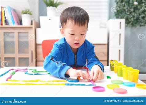 Little Asian Boy Child Having Fun Playing Colorful Modeling Clay Play