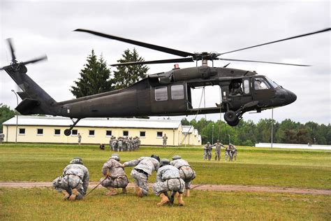 Us Troops Prepare To Rappel From A Uh 60 Black Hawk Helicopter During