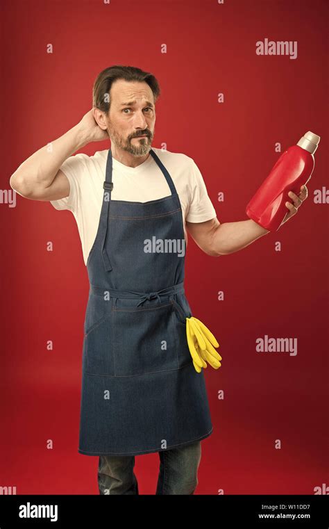 Man In Apron With Gloves Hold Plastic Bottle Liquid Soap Chemical Cleaning Agent Cleaning Day