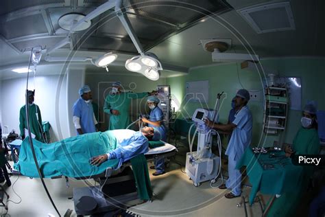Image Of Hospital Operation Theater Or Icu With Doctor Treating The