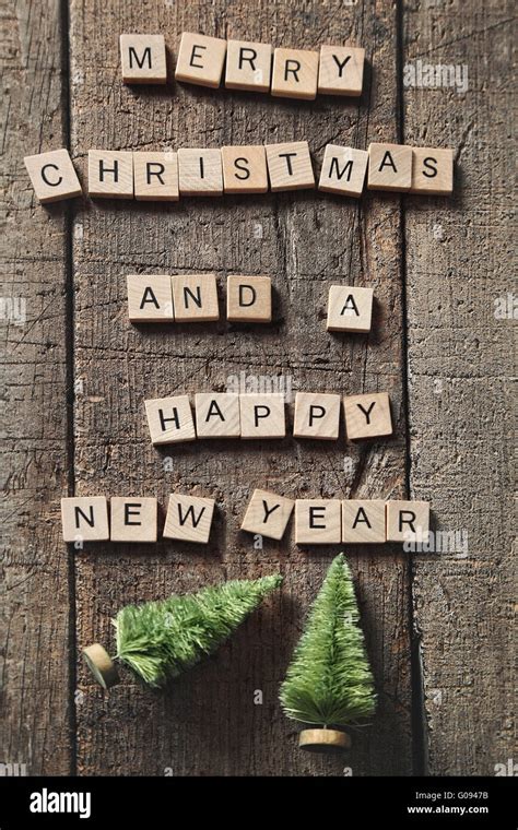 Scrabble Letters Spelling Merry Christmas On Wood Stock Photo Alamy