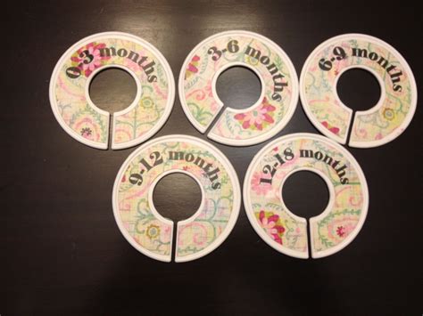 My sons' shared closet is finished and i have never been so excited about a closet before! DIY baby closet dividers using scrapbook paper, mod podge and Container Store hangers. $6 (With ...