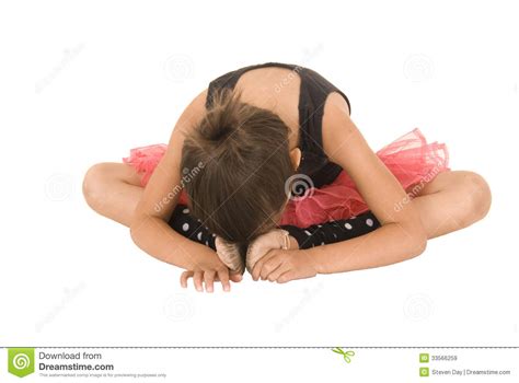 Young Ballerina Girl Bent Over Head Touching Her Feet Royalty Free