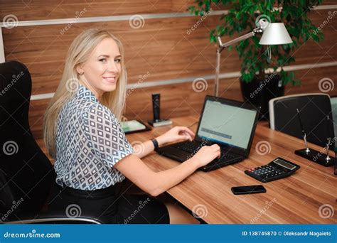 Beautiful Business Woman Working With Sales In Her Office Stock Photo