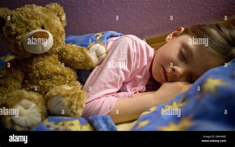 The Illustration Shows 6 Year Old Amy Sleeping In Her Bed Next To Her