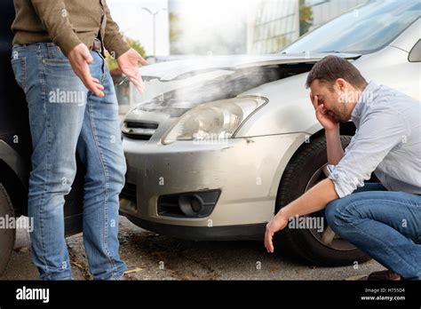 Two Men Arguing After A Car Accident On The Road Stock Photo Alamy