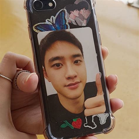 A Person Holding Up A Cell Phone Case With A Photo On It
