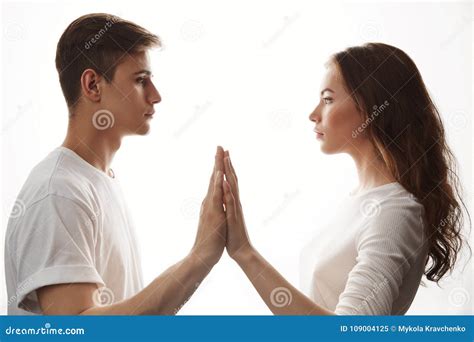 Couple In Love Looking At Each Other In White Room Man And Woman